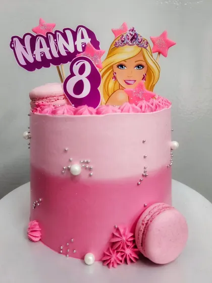 Just a little pink. A Barbie-themed cake for Naina's 8th birthday, featuring a pink ombre design, macarons, and silver pearls.