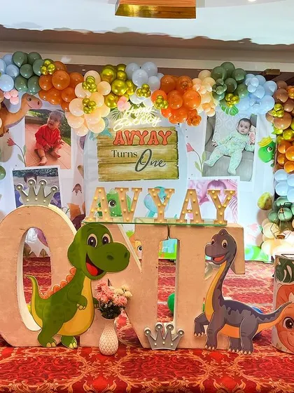 A roaring good time with this dinosaur-themed first birthday. We used cute dino cutouts, a custom 'ONE' table, and a milestone photo board to celebrate the big day.