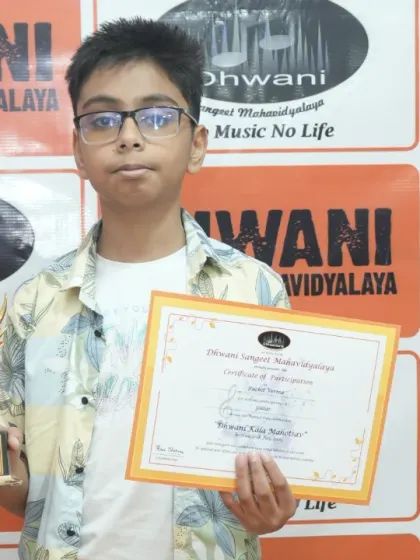 A young student poses with his award from the annual function. We aim to build confidence in our students through acknowledgement of their hard work.