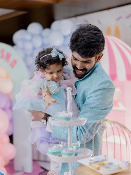 A father and daughter share a sweet moment at the dessert table. Our events are all about creating these precious memories.