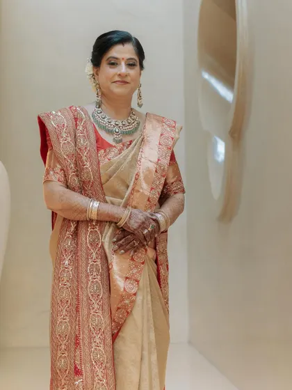 A poised portrait of the mother of the groom in her bespoke saree. I work closely with family members to create outfits that are both elegant and comfortable.