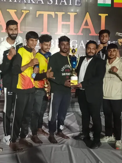 The team with their trophies after a successful run at the Karnataka State Muay Thai Championship.