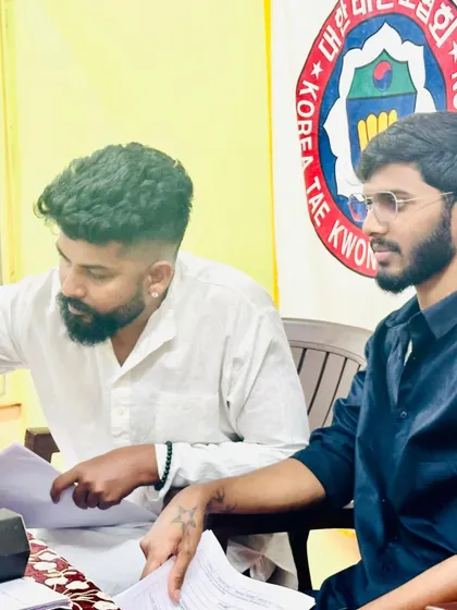Discussing a student's performance with a fellow examiner.