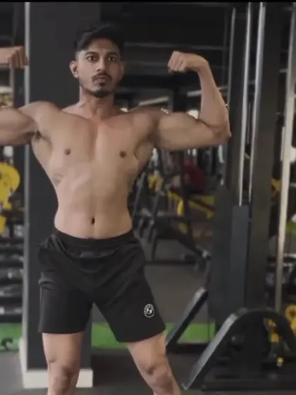 Building a masterpiece, one rep at a time. A double bicep front pose.