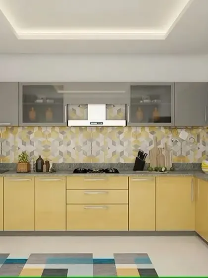This cheerful L-shaped kitchen features yellow lower cabinets and grey uppers, paired with a geometric-patterned backsplash. The design is bright, modern, and full of personality.