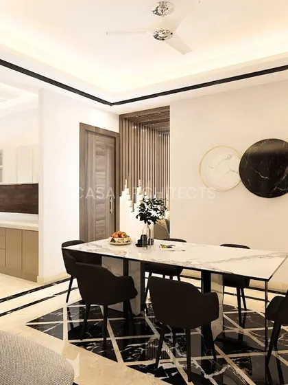 A modern dining area concept with a black and white marble-tiled floor, a simple yet elegant dining table, and a view into a sleek, minimalist kitchen.