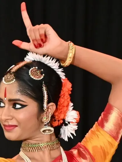 A student's arangetram is a testament to my teaching philosophy. This image of Anvita Jain showcases the precision in form and expression that we cultivate, even for students with no prior background in South Indian culture.