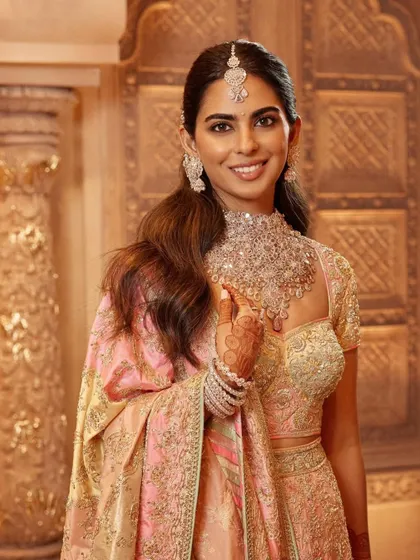 A detailed shot of the Abu Jani Sandeep Khosla ensemble, focusing on the brilliant diamond necklace and matching earrings. Accessorizing is key to elevating any couture look.