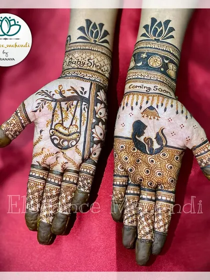 A special baby shower mehendi for a beautiful mom-to-be. One hand features a cradle, while the other shows a mother and baby silhouette with the words "Coming Soon."