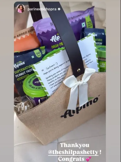 Actress Parineeti Chopra receiving her curated gift, part of a coordinated campaign to build brand visibility.