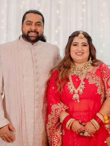 The happy couple. Her reception makeup was designed to be glamorous yet comfortable, allowing her to enjoy her special evening to the fullest.
