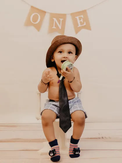 A happy moment from a studio session, with the birthday boy chewing on a toy.