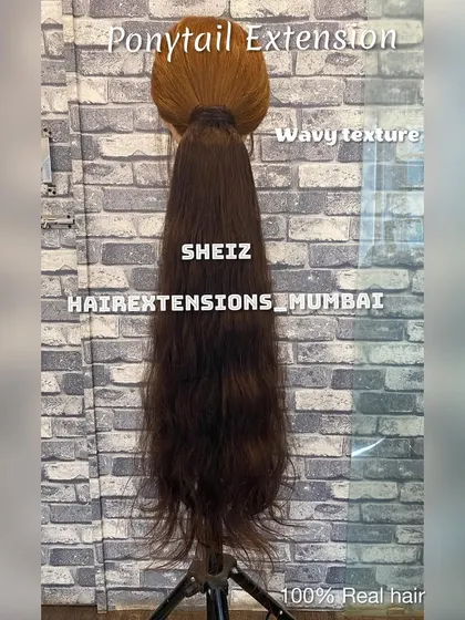 A wavy textured ponytail extension, perfect for adding a bohemian or beachy vibe to your look.