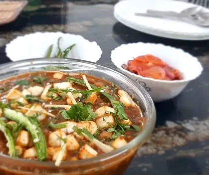 A closer view of the meal, focusing on the bowl of chole and the side of pickled onions. It’s a classic North Indian combination that I love making and sharing.