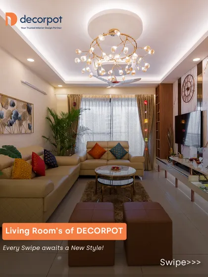 A bright and cheerful living room design. We used a neutral sofa as a base and added pops of color with cushions, along with a statement chandelier and a sleek TV unit with open shelving.