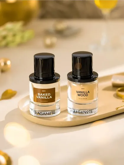 Showcasing Fraganote's vanilla fragrances in a festive, warm setting. The golden accents and soft lighting create a cozy and luxurious feel, perfect for a holiday campaign.