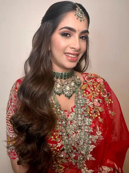 A close-up of the final reception look, showcasing the beautiful smile and timeless makeup.