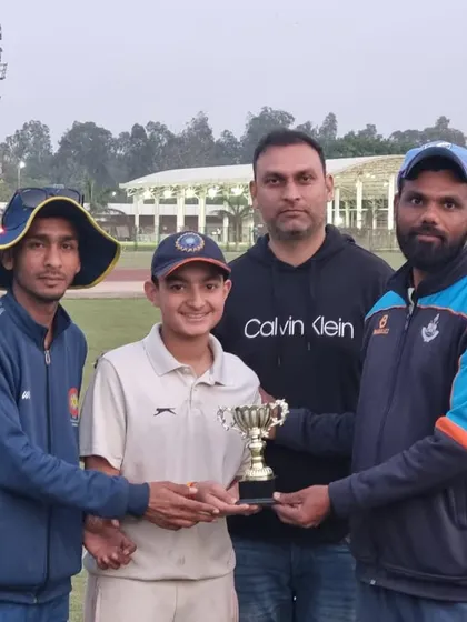 Presenting a trophy to a deserving young cricketer after a match in Delhi. These moments build confidence and a love for the game.