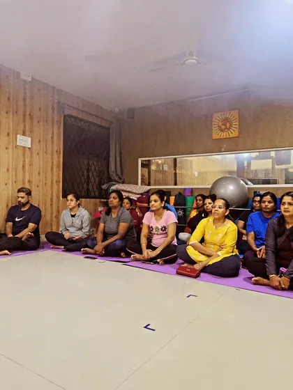 Our yoga community gathered together, seated and ready to participate in the Rathasaptami Suryathon event.