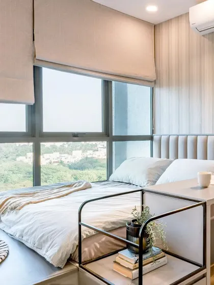 A kid's room featuring a sleek platform bed and a study-side table combo with a curved metal unit for a functional and stylish look.
