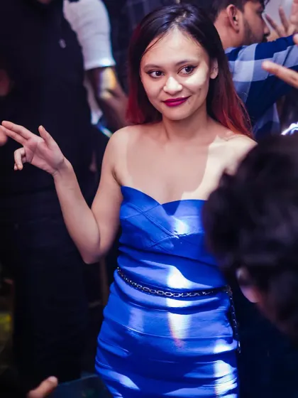 A guest dancing in the crowd.