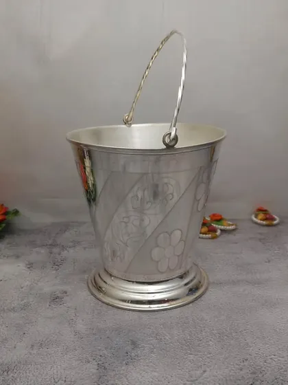 A German silver bucket, beautifully designed and available in various sizes. It can be used for holding flowers or holy water.