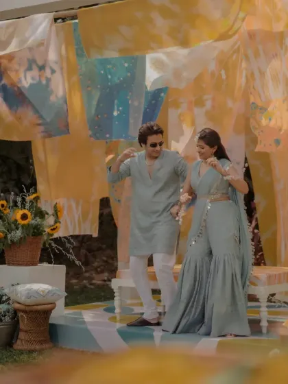 The couple dancing and enjoying their celebration on the custom-designed stage of their "Dhobi Ghat" Haldi.