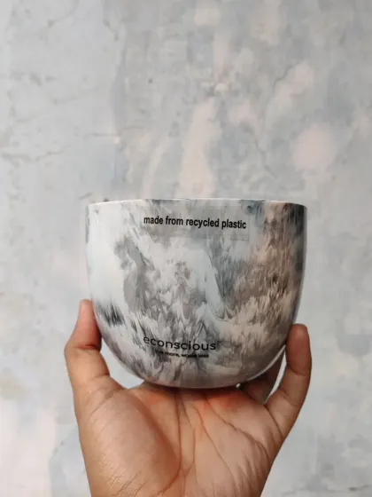 This planter features a sophisticated grey and white marble finish, resembling natural stone. It's a testament to how recycled materials can be transformed into elegant home and office decor.