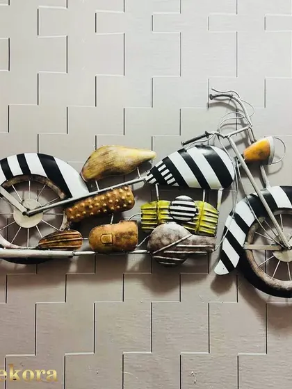 An antique-style motorcycle sculpture, handcrafted from iron with a black and white striped design. A perfect piece for a garage, man cave, or themed room.