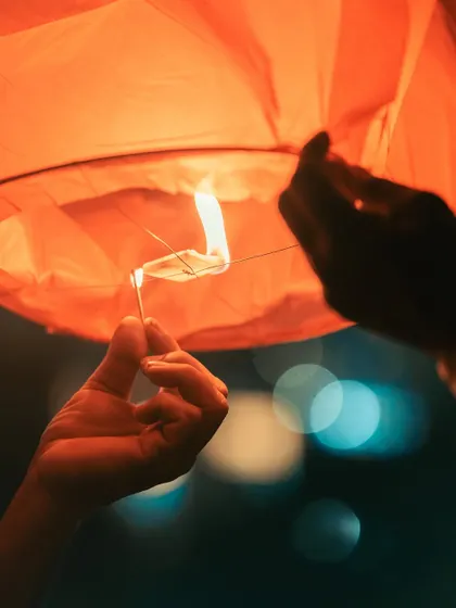 Lighting a sky lantern on Diwali. This moment, full of hope and light, is one of my favorite parts of the celebration to photograph.