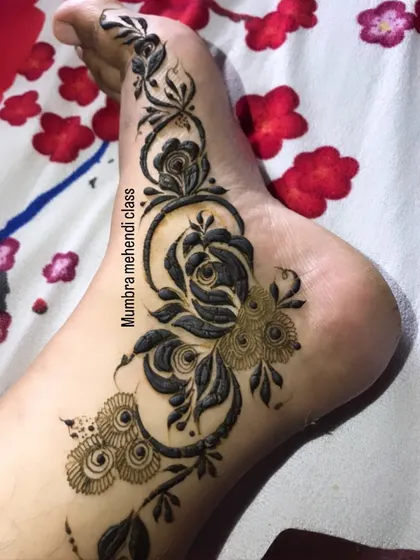 A simple and elegant floral vine design for the side of the foot.