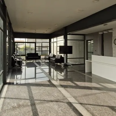 The main reception and waiting lounge at Torishima Pumps. Polished stone floors reflect the ample natural light that floods the space through floor-to-ceiling glass walls, creating a bright and welcoming entrance.