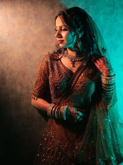 A creative and moody portrait from a ring ceremony, using dual-toned lighting for an artistic effect.