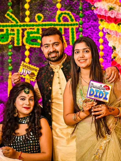 Fun with family and props at the Mehndi party. We capture the lighthearted moments with siblings and friends that add so much personality to your wedding album.