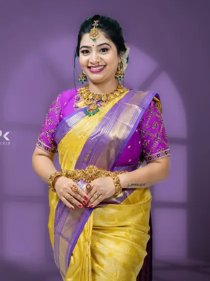 A front view of the purple and gold embroidered blouse, a perfect example of a traditional yet trendy look.