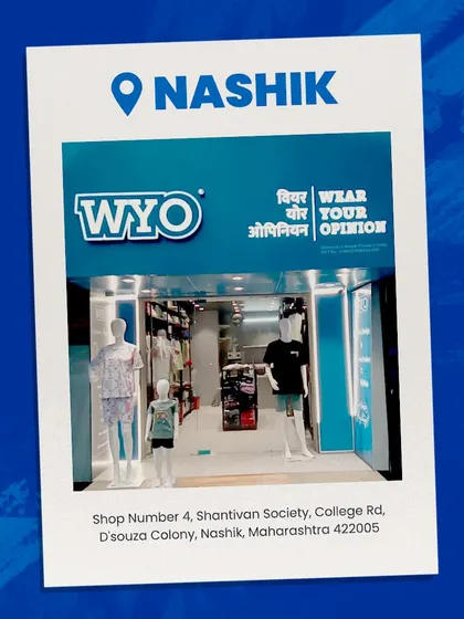 Announcing my new store in Nashik, with the address and a photo of the storefront.