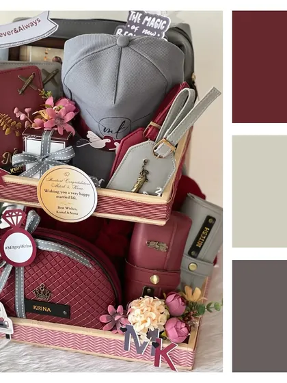 A bestseller for a reason. This wedding hamper combines rich maroon and neutral tones, featuring personalized travel accessories, caps, and pouches for the happy couple.
