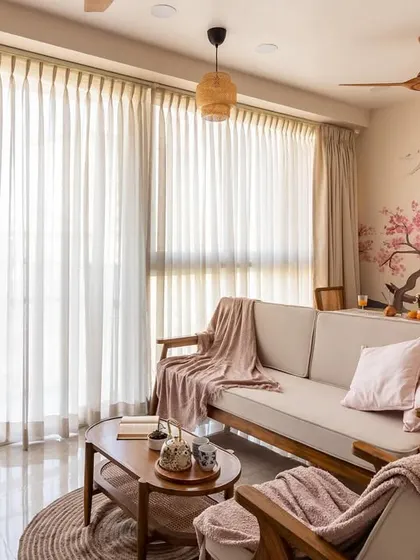 Another perspective of this tranquil living room, highlighting the soft textures and natural light that make the space feel warm and inviting.