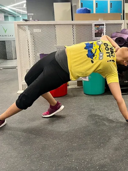 A duplicate image of the Wild Thing pose, emphasizing its importance as a go-to stretch for heart opening and releasing tension.