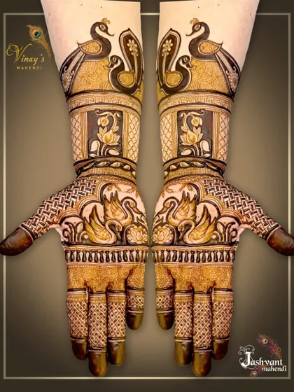 This series showcases a designer mehndi rich with fauna, including peacocks, swans, and elephants, blended with lotus flowers and traditional patterns for a full and festive look.
