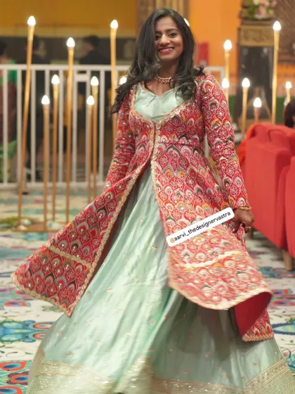 A full view of the stunning jacket lehenga, a perfect fusion of traditional prints and modern silhouette.