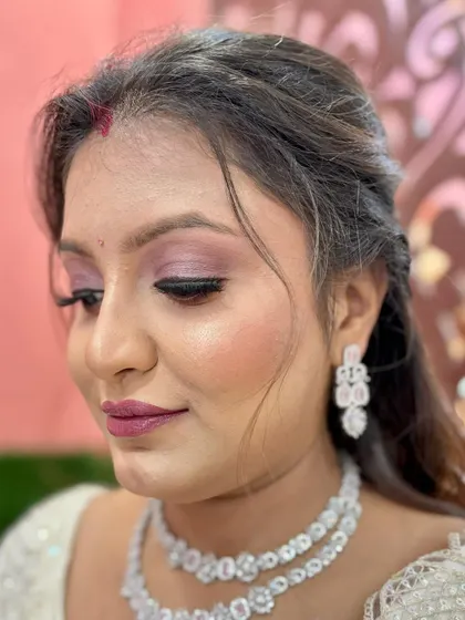 A side profile of the soft party glam, highlighting the gentle contour and the pretty lip color.
