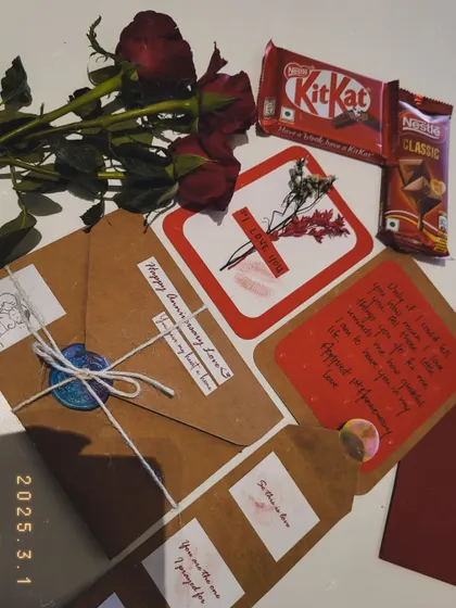 Receiving gifts from your "pasandida aurat" (favorite woman) is a special feeling. This anniversary hamper includes chocolates, roses, and handmade cards.