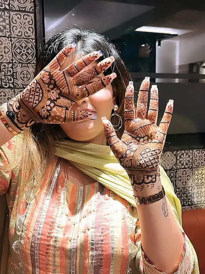 A happy client showing off her festive mehndi. I love seeing the joy my art brings to people.