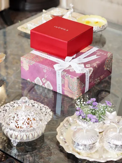 The joy of gifting is in the details. Here, my signature gift boxes sit alongside elegant silver serveware, showcasing a complete luxury gifting experience where presentation is as important as the gift itself.