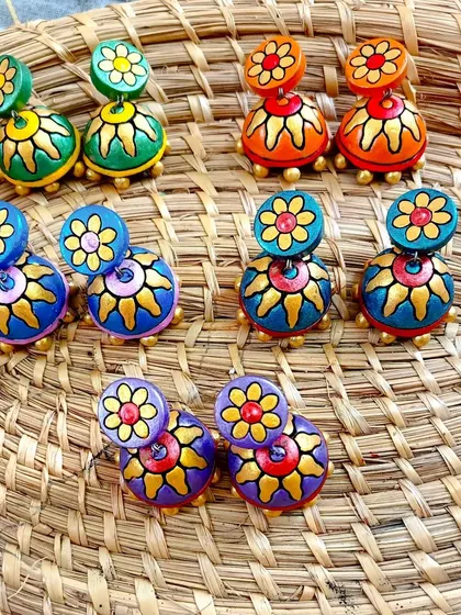 These images display the extensive variety of earrings I create, from jhumkas to studs and danglers, all showcasing different patterns, colors, and shapes ready for bulk orders.
