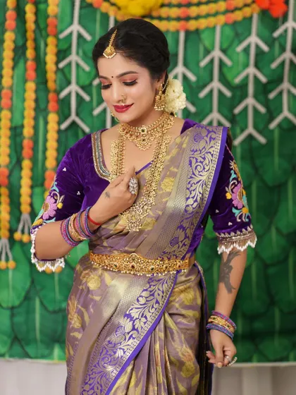 The full bridal look, complete with a waist belt, showcases a regal and elegant style.
