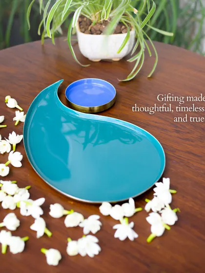 Gifting made thoughtful, timeless, and true. The paisley tray in a beautiful teal, scattered with fresh jasmine, is a perfect example of how our pieces can be used for both serving and decor.
