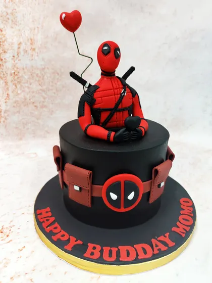 We bring the "Merc with a Mouth" to the party with this striking Deadpool cake. A detailed figure of the anti-hero sits atop a sleek black cake, complete with his utility belt and a heart-shaped balloon for a touch of his signature humor.