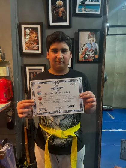 Another young student achieving his first milestone. He has cleared Level One and earned his yellow belt, building a strong foundation in martial arts.